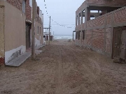 Vendo terreno cercado 1/2 cdra de playa arica